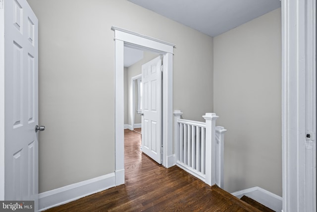 corridor featuring dark hardwood / wood-style floors