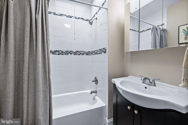 bathroom featuring vanity and shower / bath combo