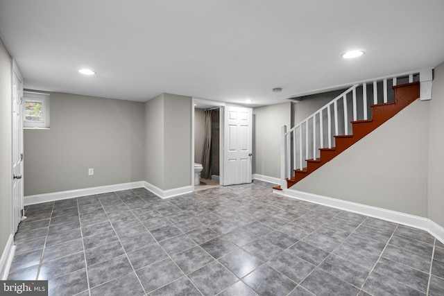 basement with dark tile patterned floors