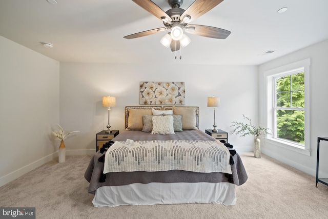 carpeted bedroom featuring ceiling fan