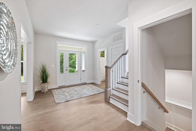 foyer entrance with light wood-type flooring