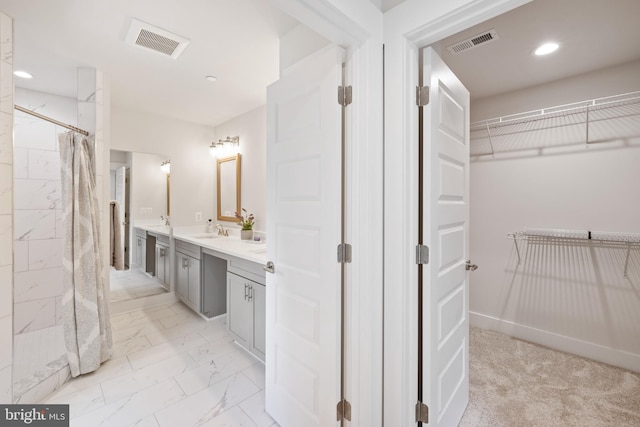 bathroom featuring vanity and walk in shower