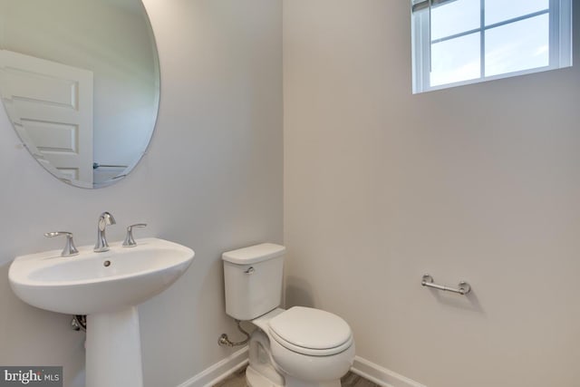 bathroom featuring sink and toilet