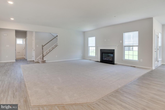 unfurnished living room featuring light wood-type flooring