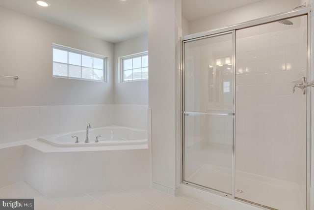 bathroom with tile patterned flooring and plus walk in shower