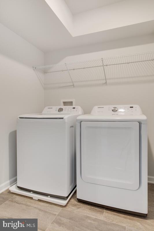 washroom with washing machine and dryer