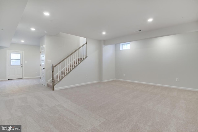 interior space featuring light colored carpet