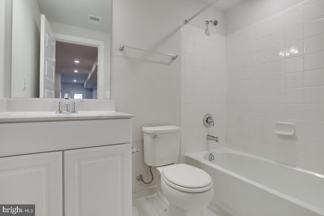 full bathroom with vanity, toilet, and tiled shower / bath combo