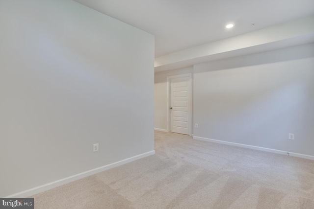 spare room with light carpet