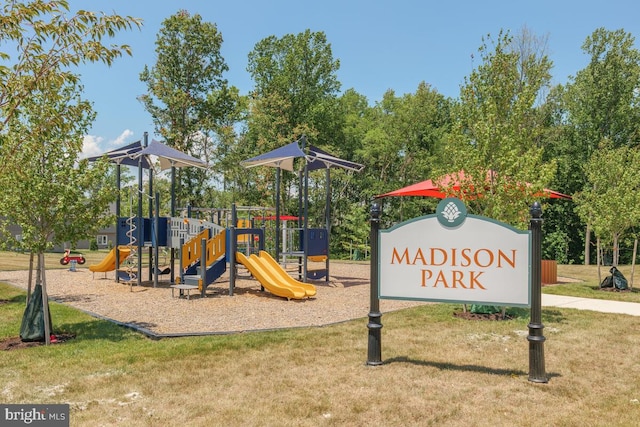 view of jungle gym featuring a lawn