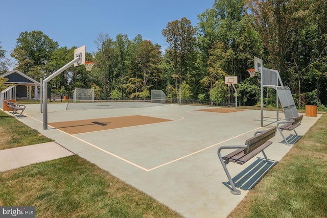 view of basketball court featuring a lawn