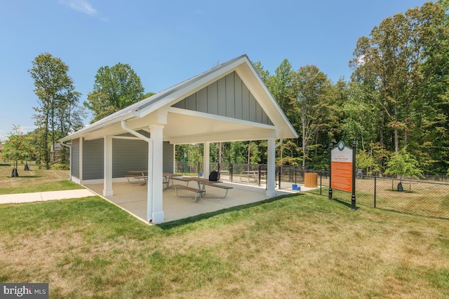 view of community with a gazebo, a patio area, and a lawn