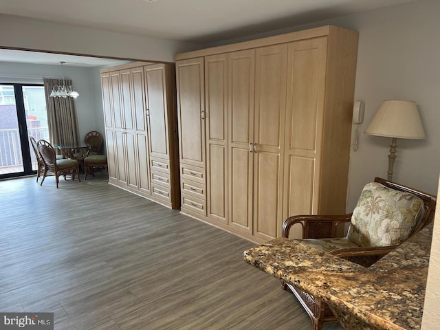 sitting room with dark hardwood / wood-style flooring