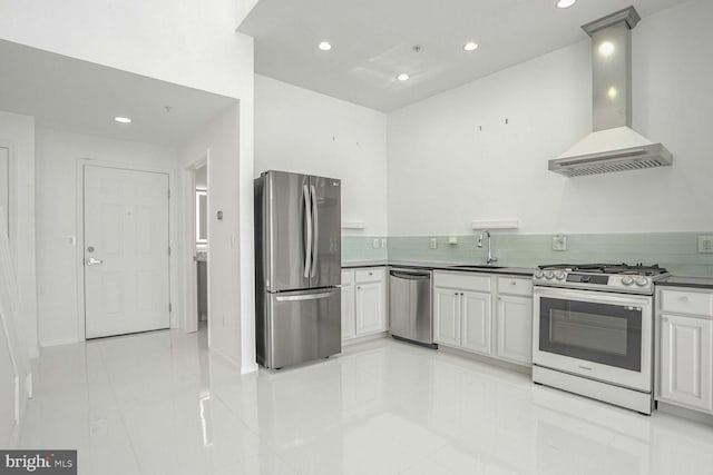 kitchen with wall chimney range hood, stainless steel appliances, and sink