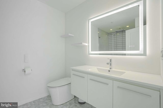 bathroom featuring vanity, a shower, and toilet