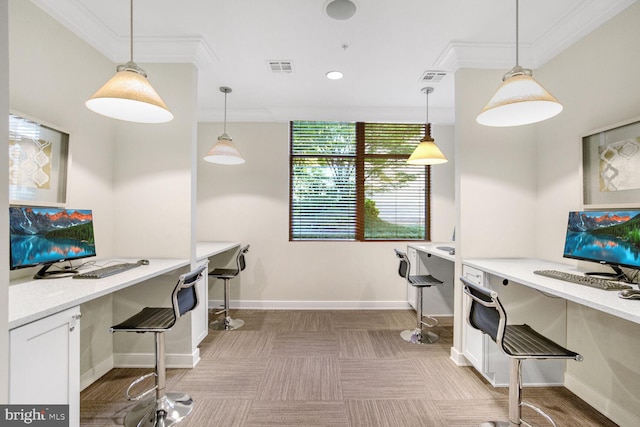 office area with built in desk and ornamental molding