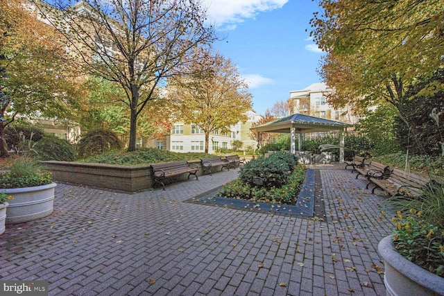 view of property's community with a gazebo and a patio