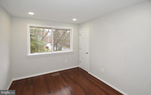 empty room featuring dark hardwood / wood-style floors