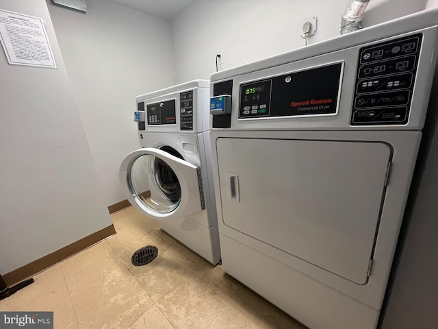 washroom featuring washer and clothes dryer