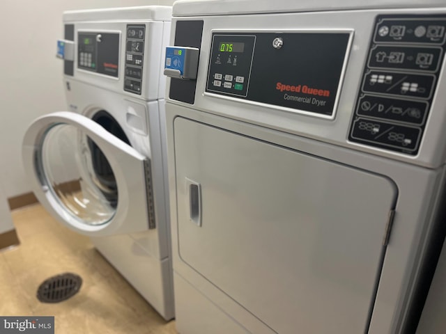 clothes washing area featuring washer and dryer