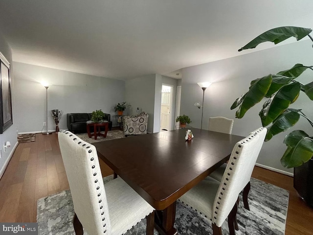 dining area featuring dark hardwood / wood-style floors