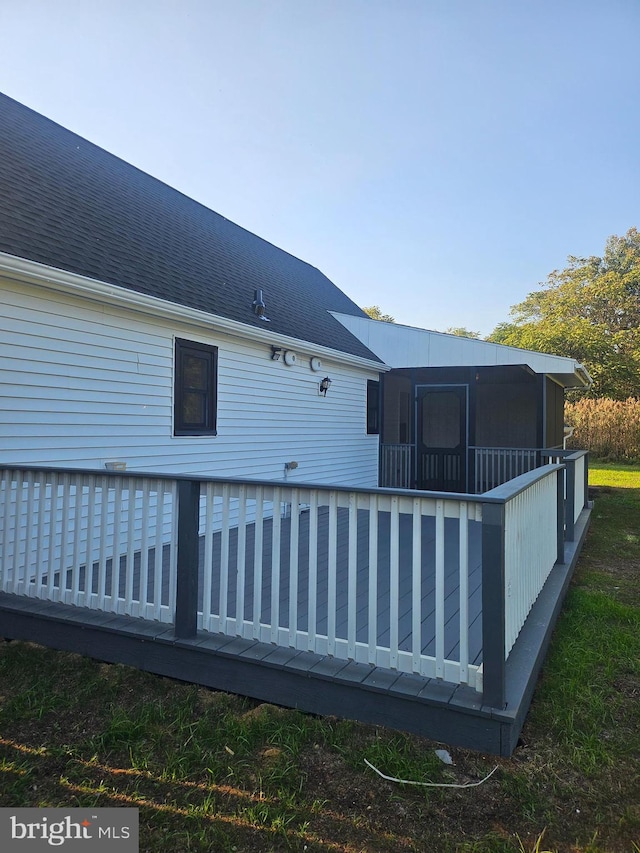 back of house with a wooden deck