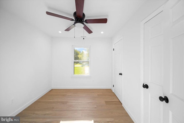 unfurnished room featuring light wood-type flooring and ceiling fan