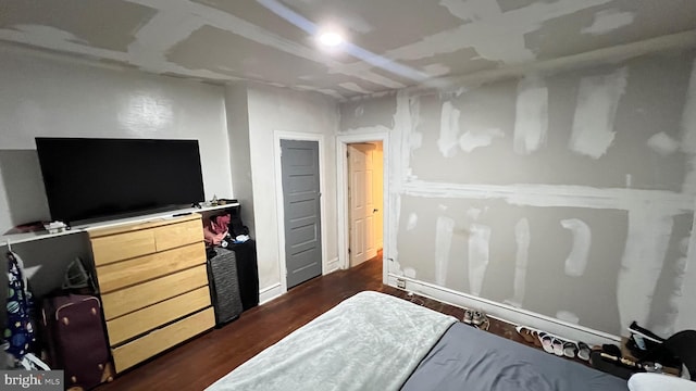 bedroom featuring dark hardwood / wood-style floors