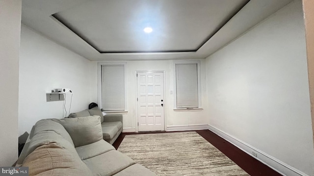 living room with dark hardwood / wood-style flooring