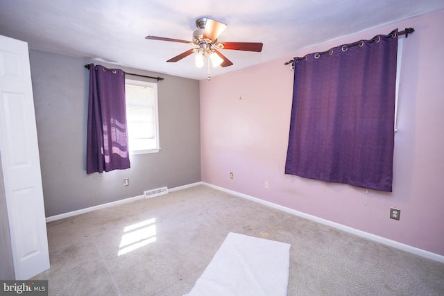 carpeted empty room with ceiling fan