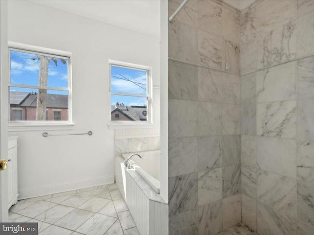 bathroom with a washtub and a wealth of natural light