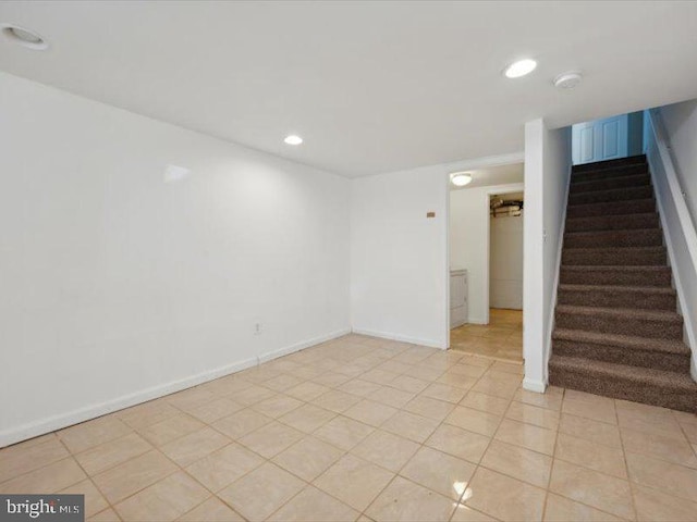 spare room featuring light tile patterned floors