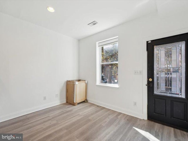 entryway with light hardwood / wood-style floors