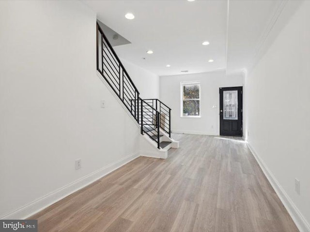 foyer entrance with light hardwood / wood-style floors