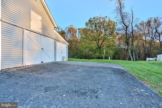 garage with a yard