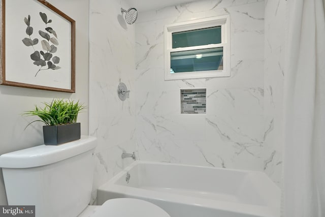 bathroom with toilet and tiled shower / bath combo