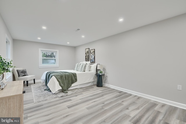 bedroom with light hardwood / wood-style floors