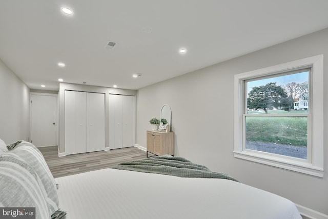 bedroom with light hardwood / wood-style floors