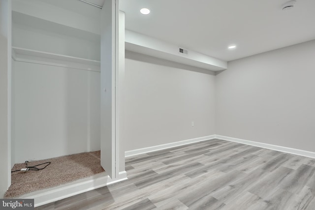 basement featuring light wood-type flooring