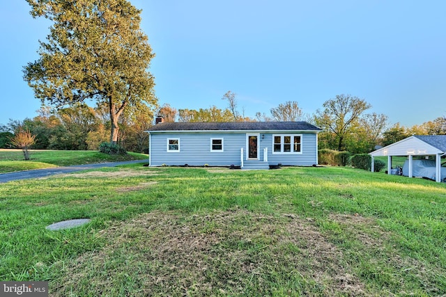 ranch-style home with a front lawn