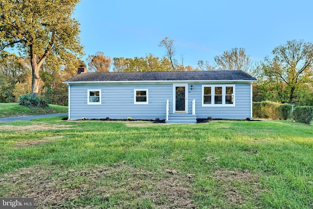 ranch-style house featuring a front lawn