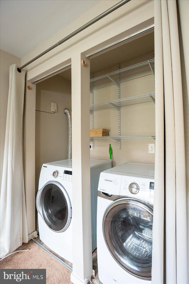 laundry area with washing machine and dryer