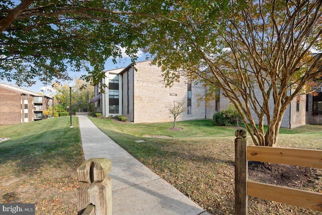 view of home's exterior featuring a lawn