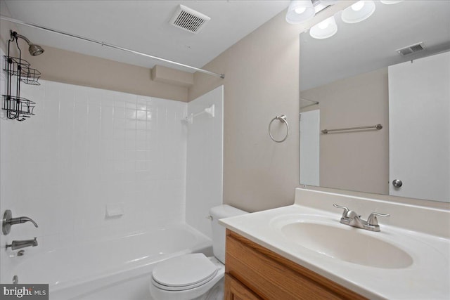 full bathroom with vanity, toilet, and tiled shower / bath combo