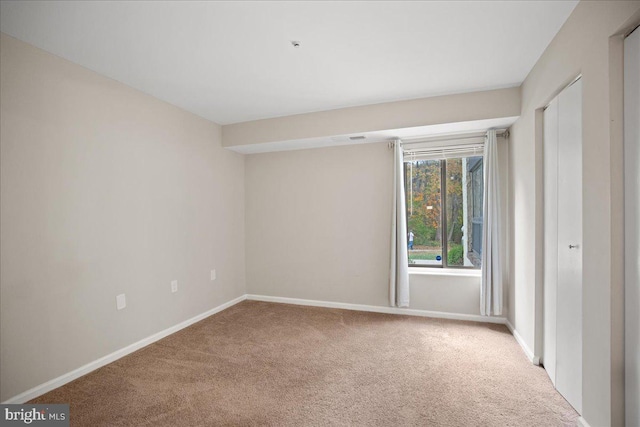 spare room featuring carpet flooring