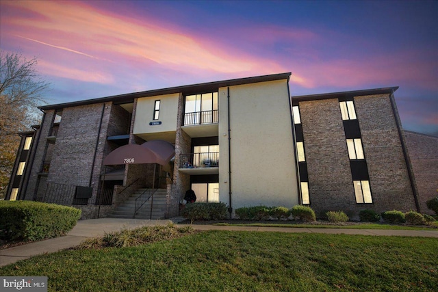 view of outdoor building at dusk