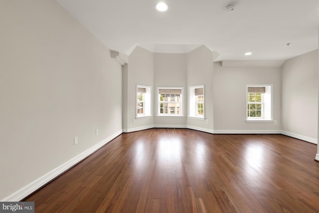 spare room featuring dark hardwood / wood-style floors