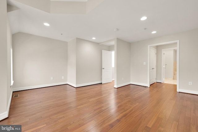 spare room featuring light hardwood / wood-style floors