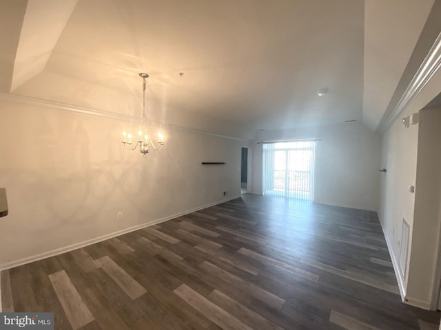 unfurnished room featuring dark hardwood / wood-style floors and a notable chandelier