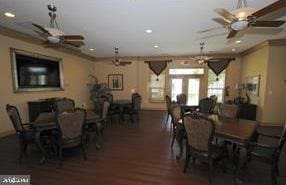 dining area featuring french doors, dark hardwood / wood-style floors, and crown molding